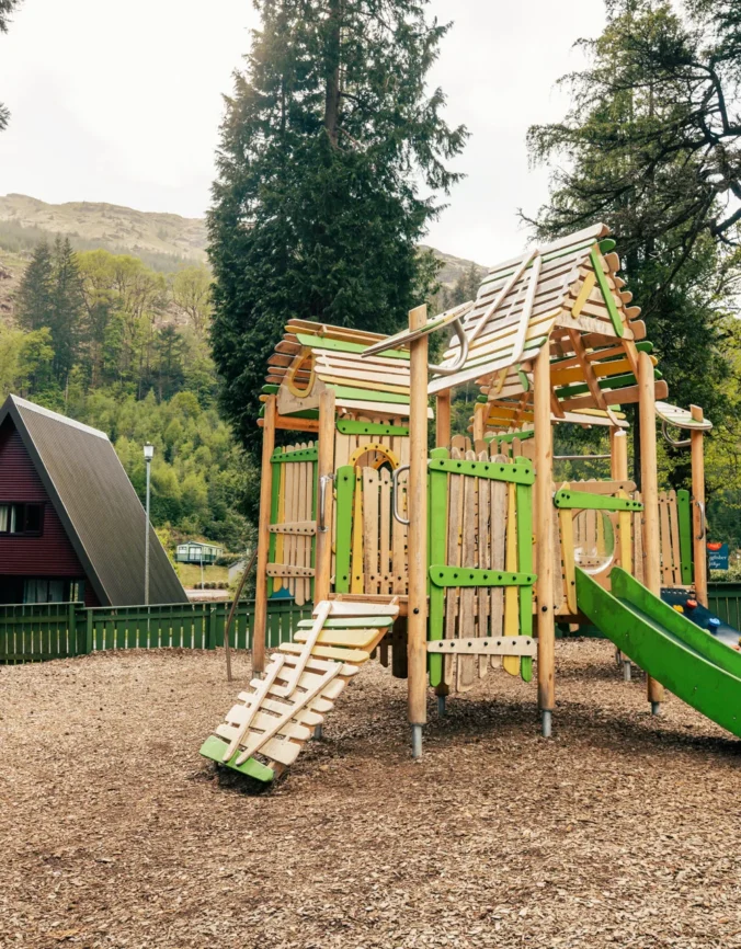 Children playing at the outdoor playground, Drimsynie Estate