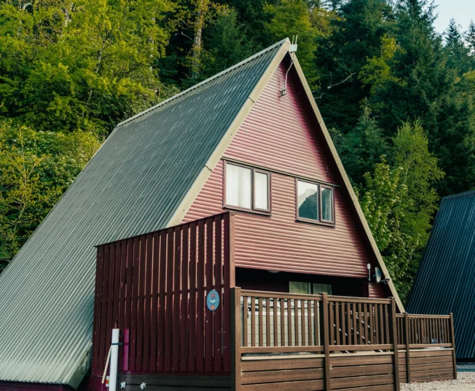 Scandinavian holiday lodge among the trees at an Argyll Holidays park